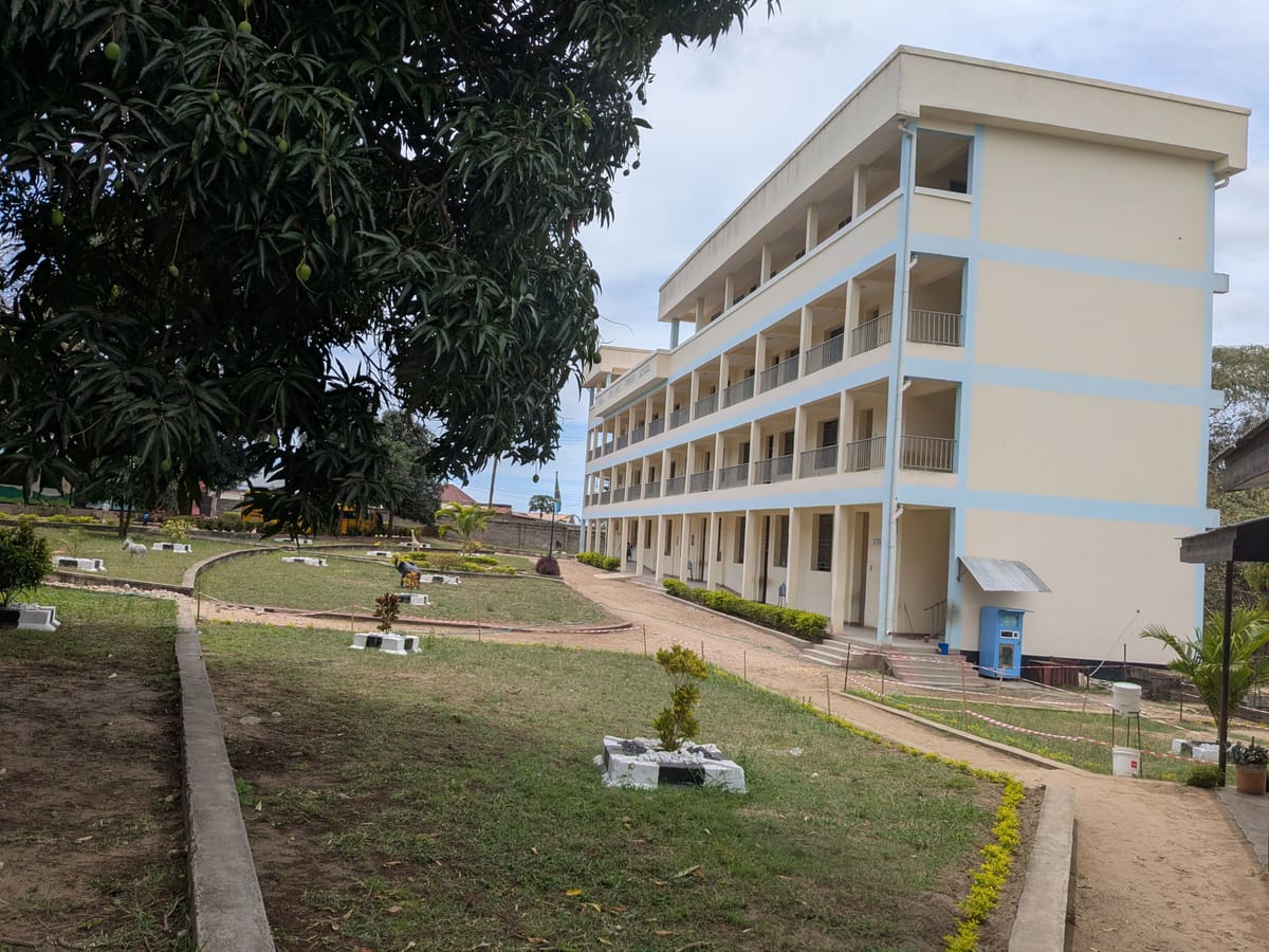 The main school building seen from the side, with the school garden in front